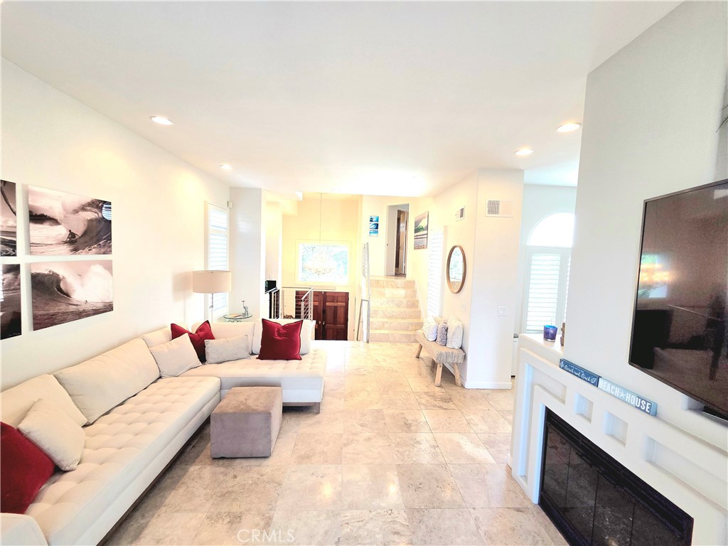 876 Cofair Court Solana Beach, CA 92075 - Photo 12 of 32 a living room with furniture and a flat screen tv