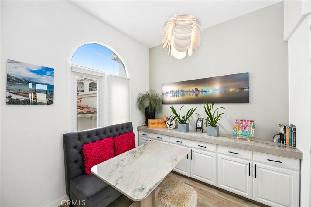 876 Cofair Court Solana Beach, CA 92075 - Photo 20 of 32 a kitchen with stainless steel appliances granite countertop a sink a stove and wooden floor