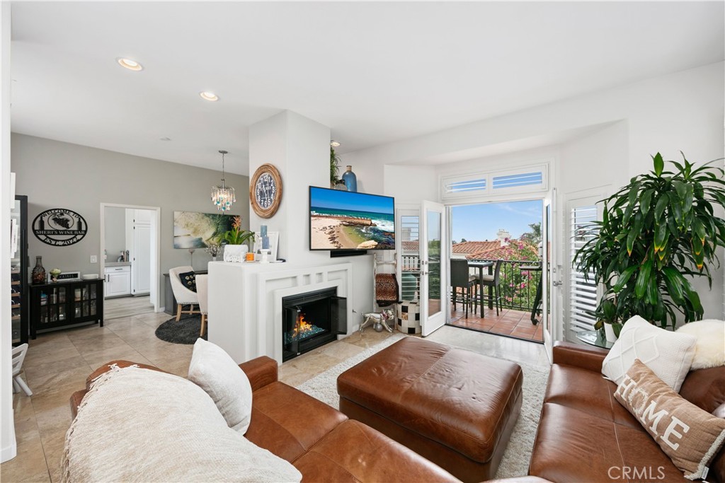 876 Cofair Court Solana Beach, CA 92075 - Photo 7 of 32 a living room with furniture and a fireplace