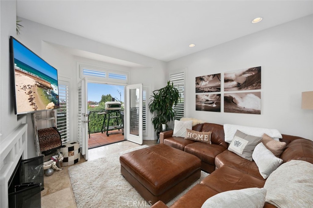 876 Cofair Court Solana Beach, CA 92075 - Photo 8 of 32 a living room with furniture and a flat screen tv