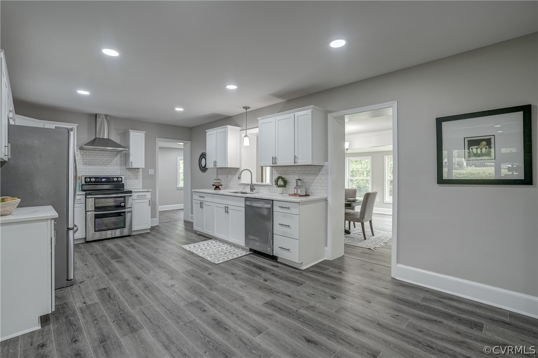 5304 River Road West Goochland, VA 23063 - Photo 22 of 47 a kitchen with stainless steel appliances kitchen island cabinets and wooden floor