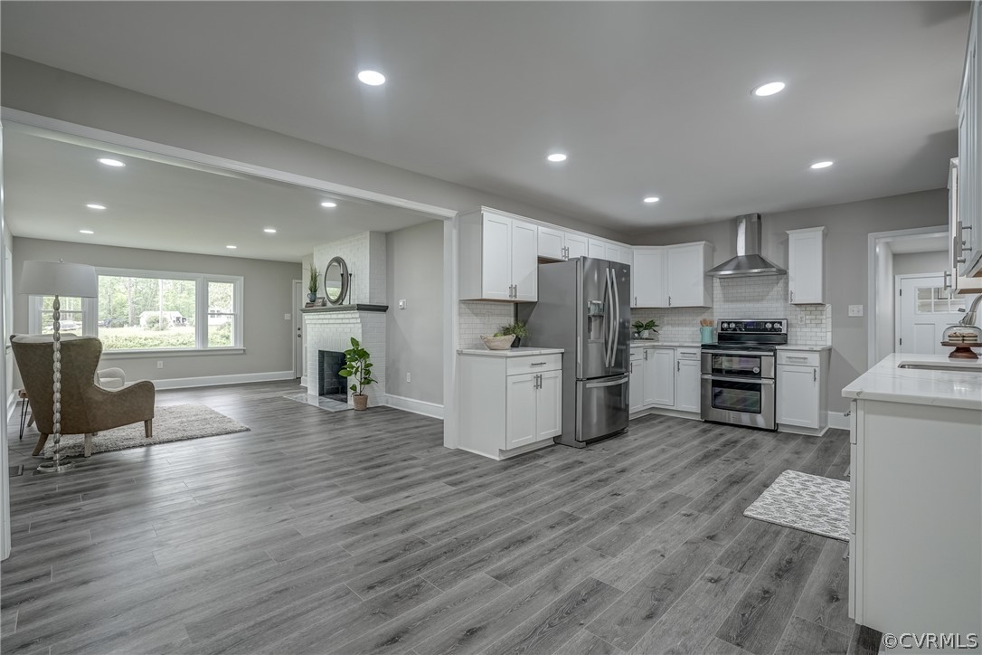 5304 River Road West Goochland, VA 23063 - Photo 24 of 47 a kitchen with a refrigerator and a stove top oven