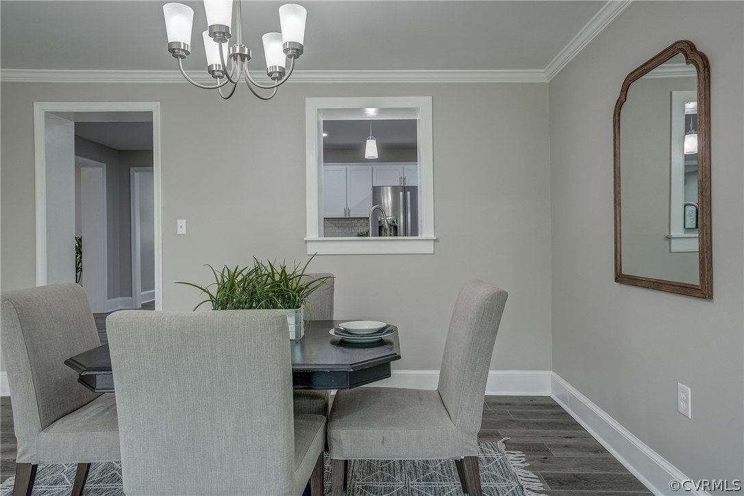 5304 River Road West Goochland, VA 23063 - Photo 40 of 47 a view of a dining room with furniture and chandelier