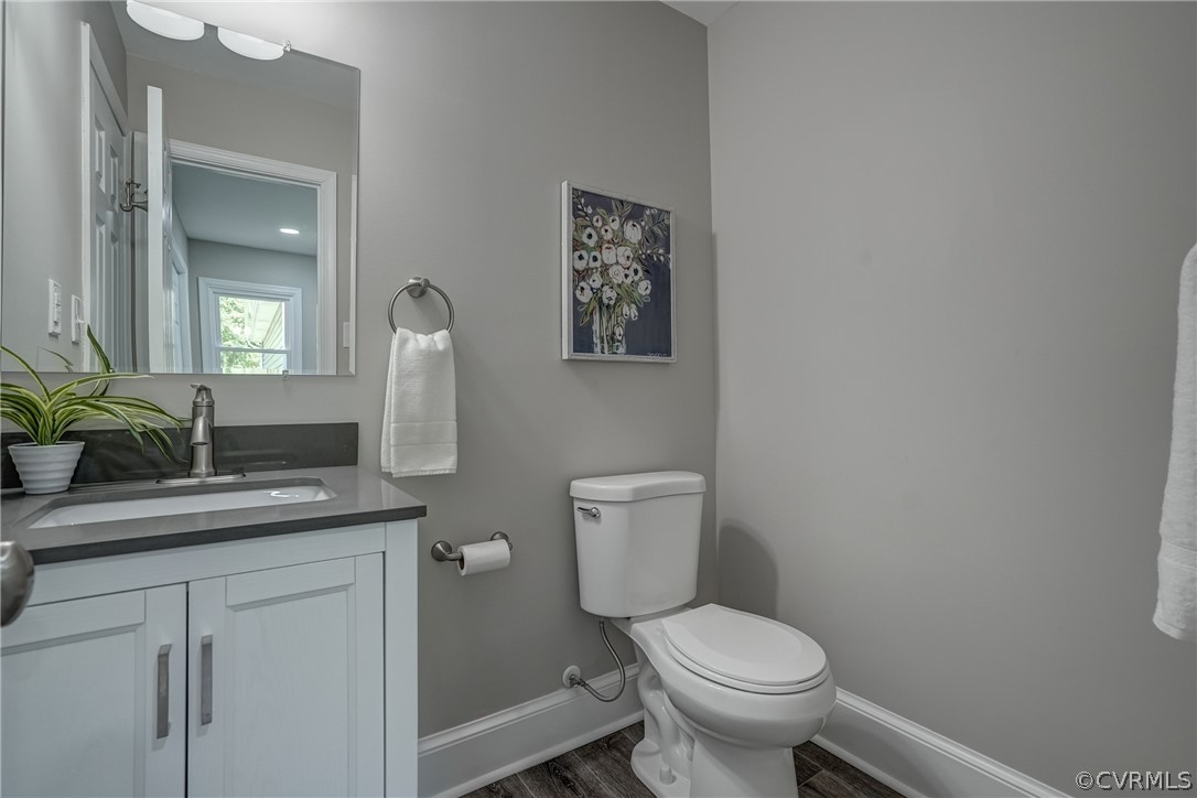 5304 River Road West Goochland, VA 23063 - Photo 44 of 47 a bathroom with a granite countertop toilet sink and mirror