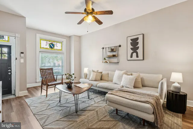 a living room with furniture and a window