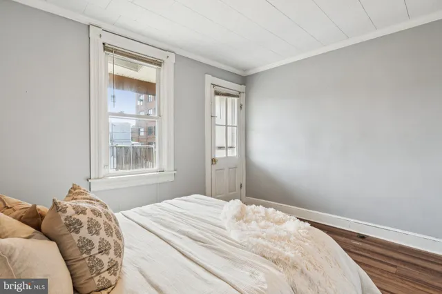 a bathroom with a granite countertop sink mirror and a bathtub