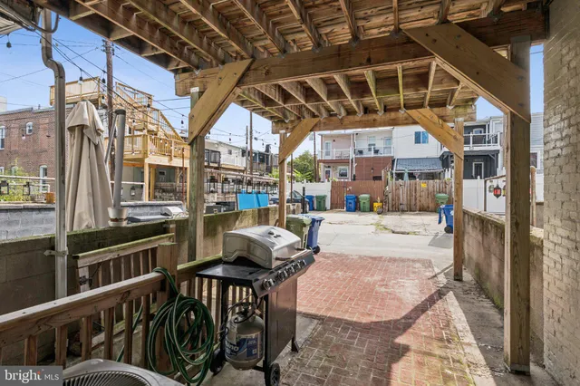 a view of a porch with furniture and a table