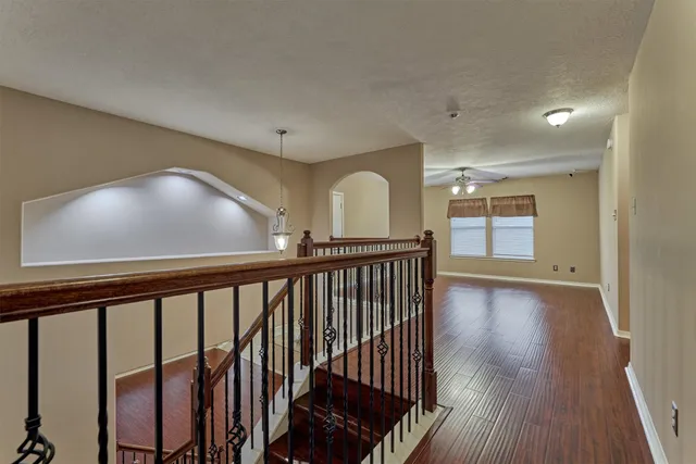 a view of hallway with wooden floor