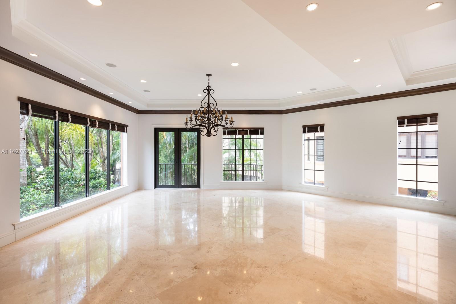 3471 Main Highway, Unit 928 Miami, FL 33133 - Photo 14 of 40 a spacious bedroom with a large bed and a large window