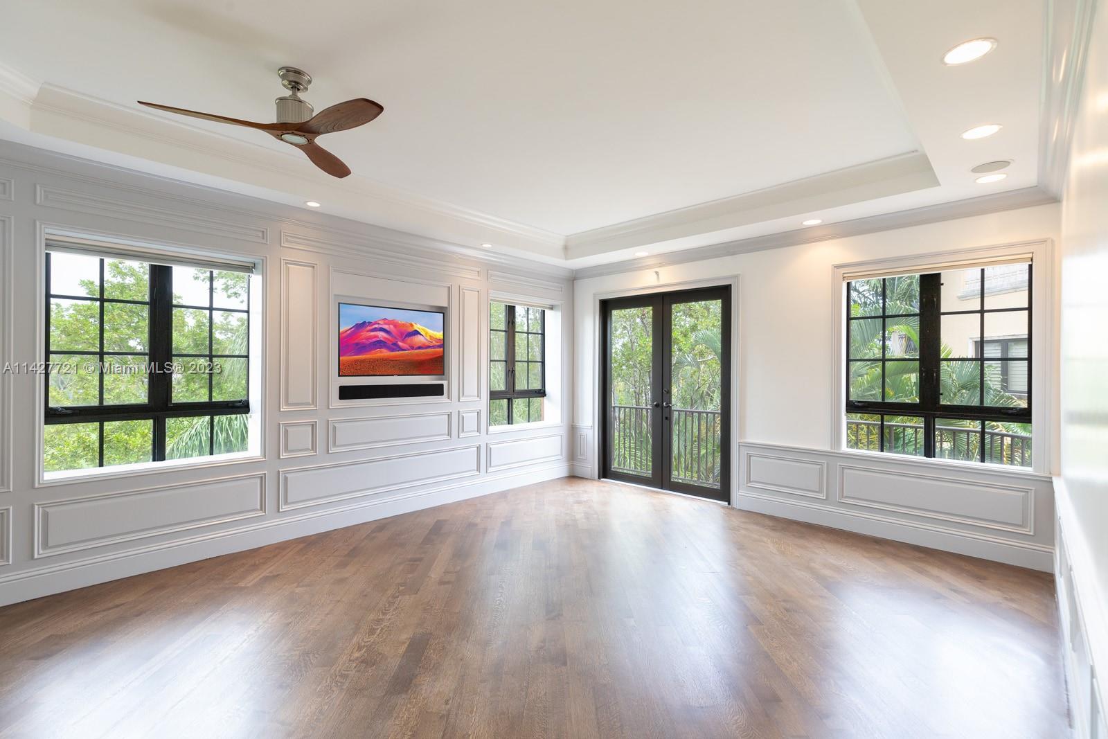 3471 Main Highway, Unit 928 Miami, FL 33133 - Photo 19 of 40 a view of room with window and hardwood floor