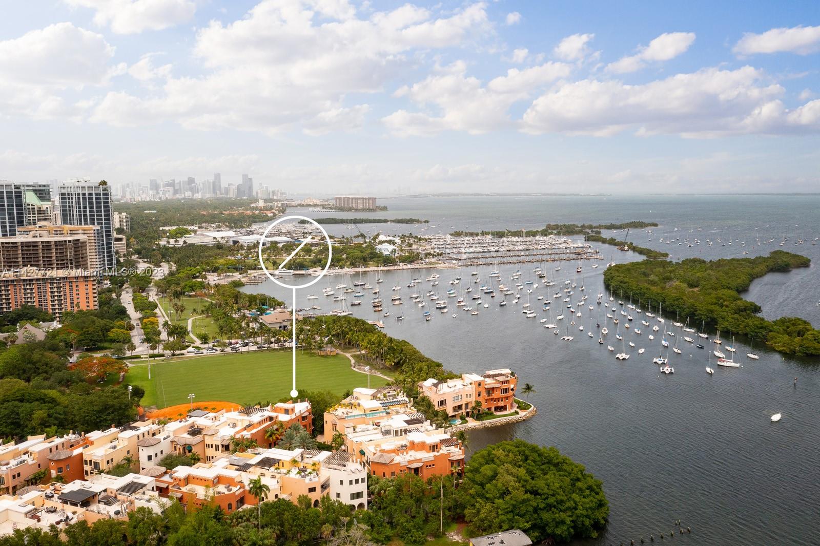 3471 Main Highway, Unit 928 Miami, FL 33133 - Photo 37 of 40 a view of a lake with a nearby beach