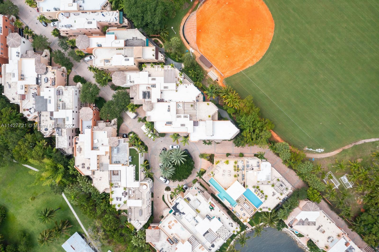 3471 Main Highway, Unit 928 Miami, FL 33133 - Photo 39 of 40 an aerial view of a house with outdoor space and street view