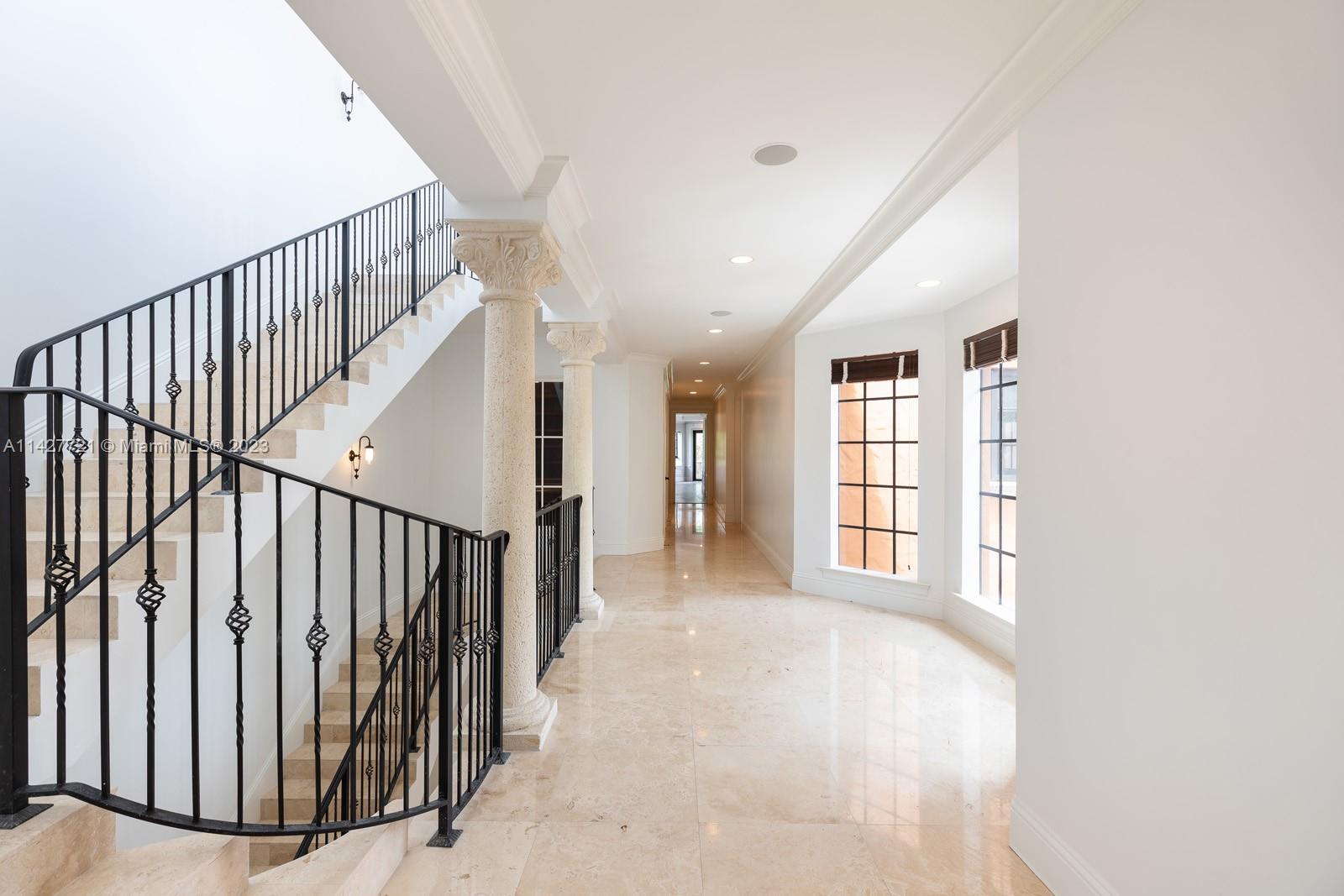 3471 Main Highway, Unit 928 Miami, FL 33133 - Photo 5 of 40 a view of a hallway with wooden floor and entryway