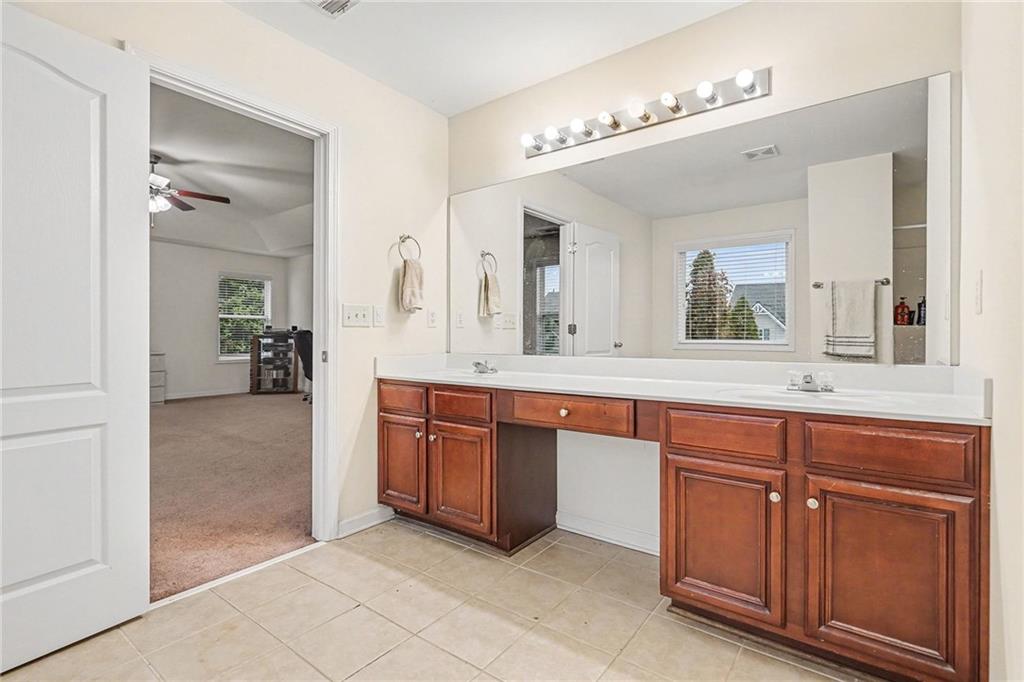 19 Laurelcrest Lane Dallas, GA 30132 - Photo 26 of 53 a spacious bathroom with a granite countertop sink and a mirror