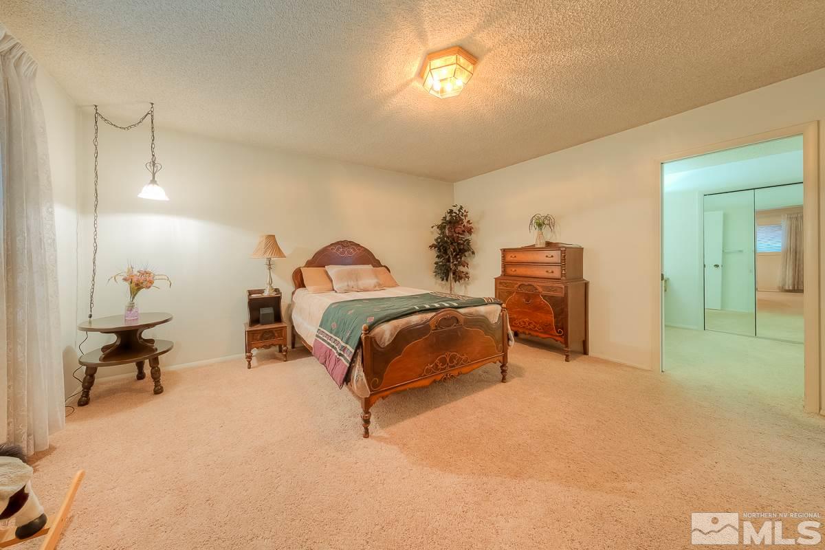 2001 Branch Reno, NV 89509 - Photo 18 of 25 a bedroom with a bed and a table in it