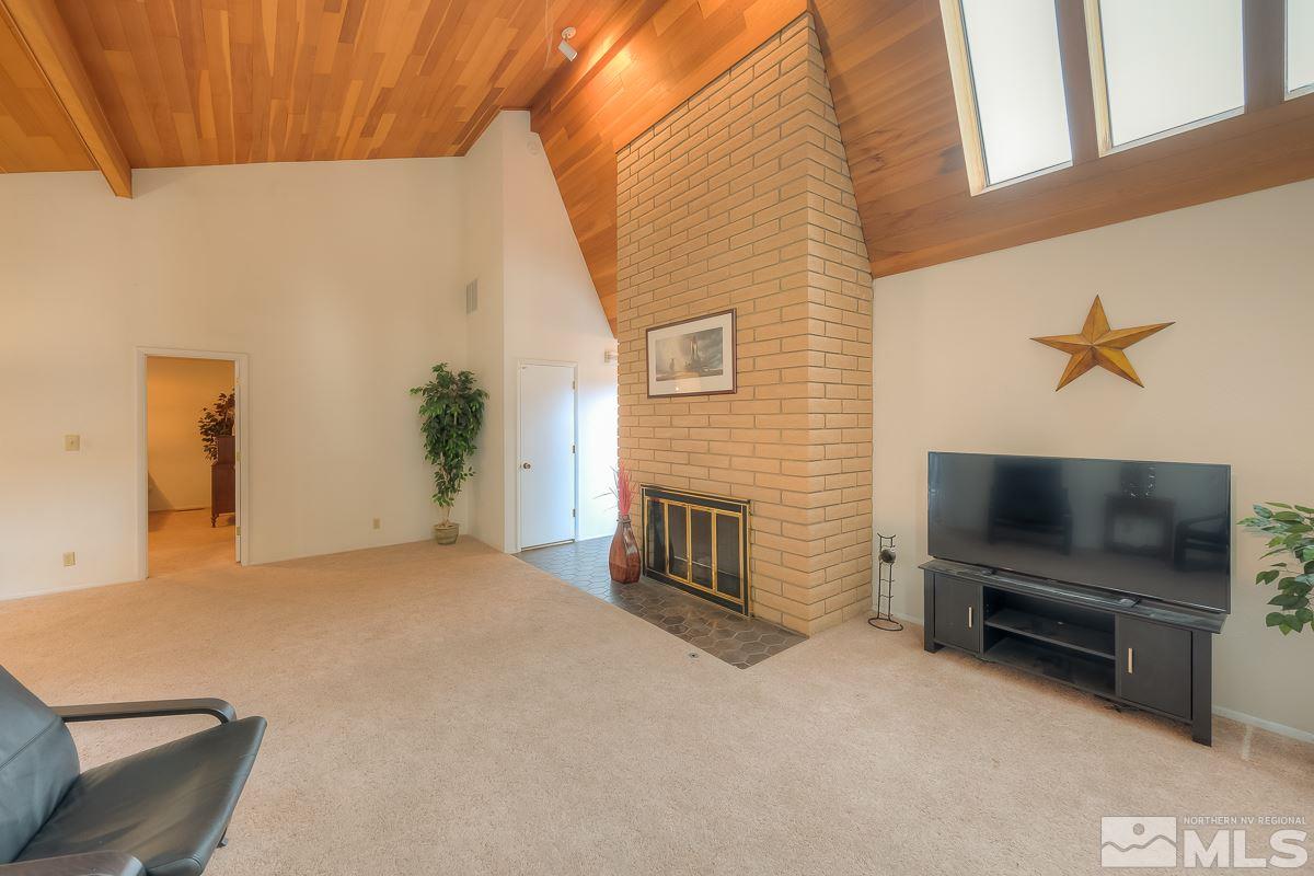 2001 Branch Reno, NV 89509 - Photo 3 of 25 a living room with furniture flat screen tv and a fireplace