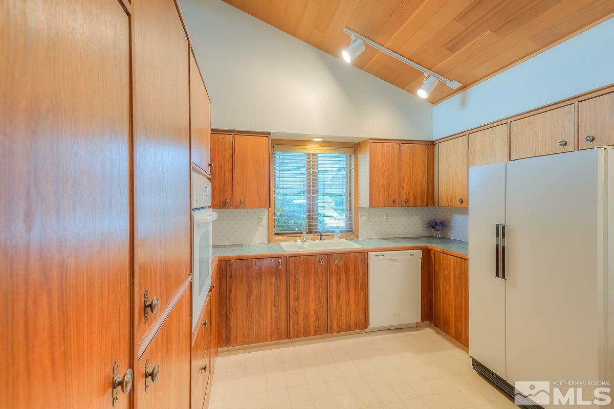 2001 Branch Reno, NV 89509 - Photo 8 of 25 a kitchen with stainless steel appliances granite countertop a refrigerator and a sink