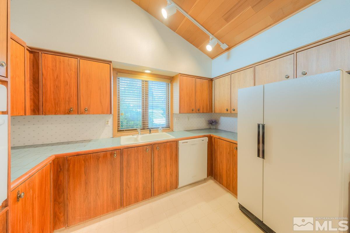 2001 Branch Reno, NV 89509 - Photo 9 of 25 a kitchen with stainless steel appliances a refrigerator and a window