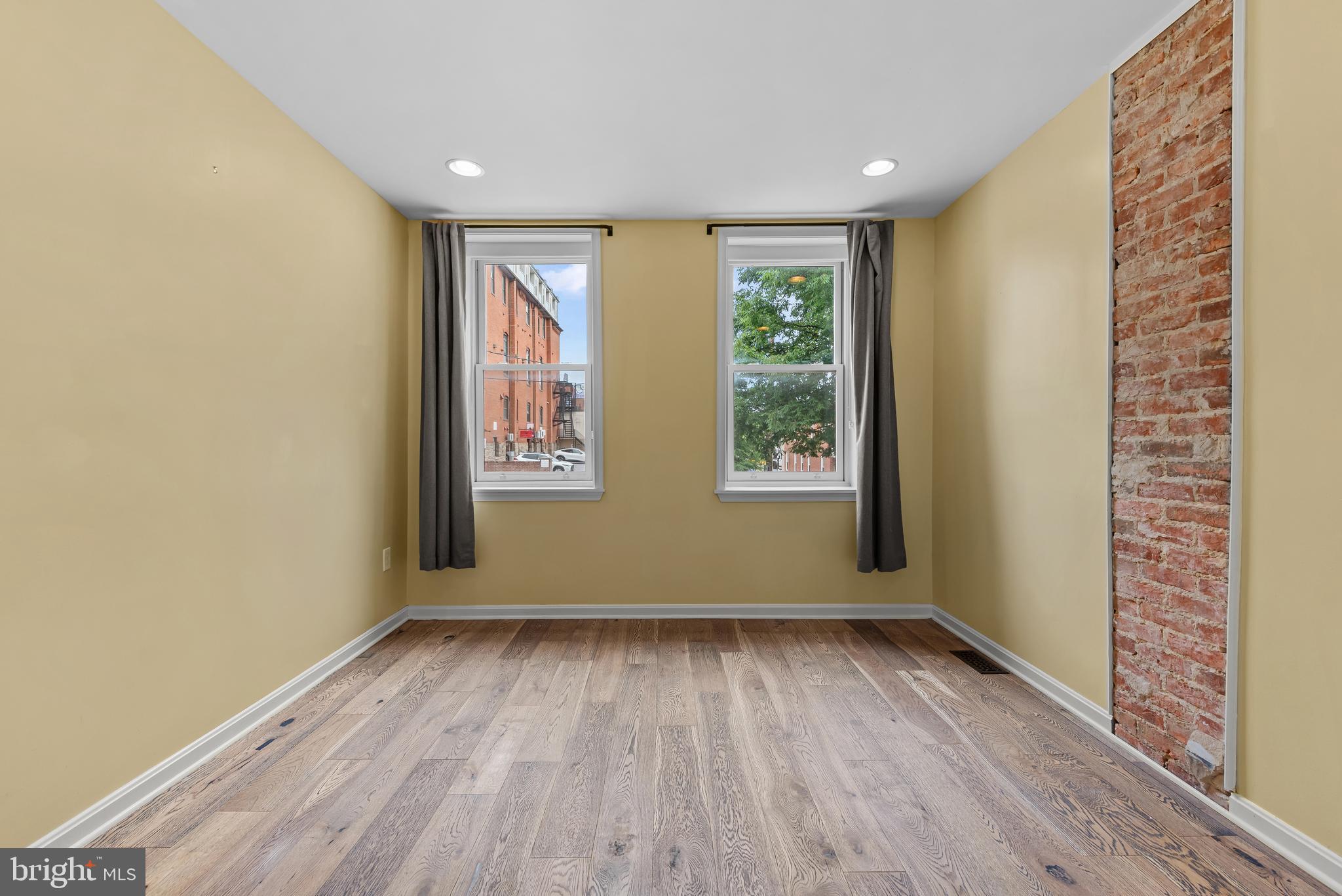 3552 Roland Avenue Baltimore, MD 21211 - Photo 18 of 28 Large second bedroom with exposed brick