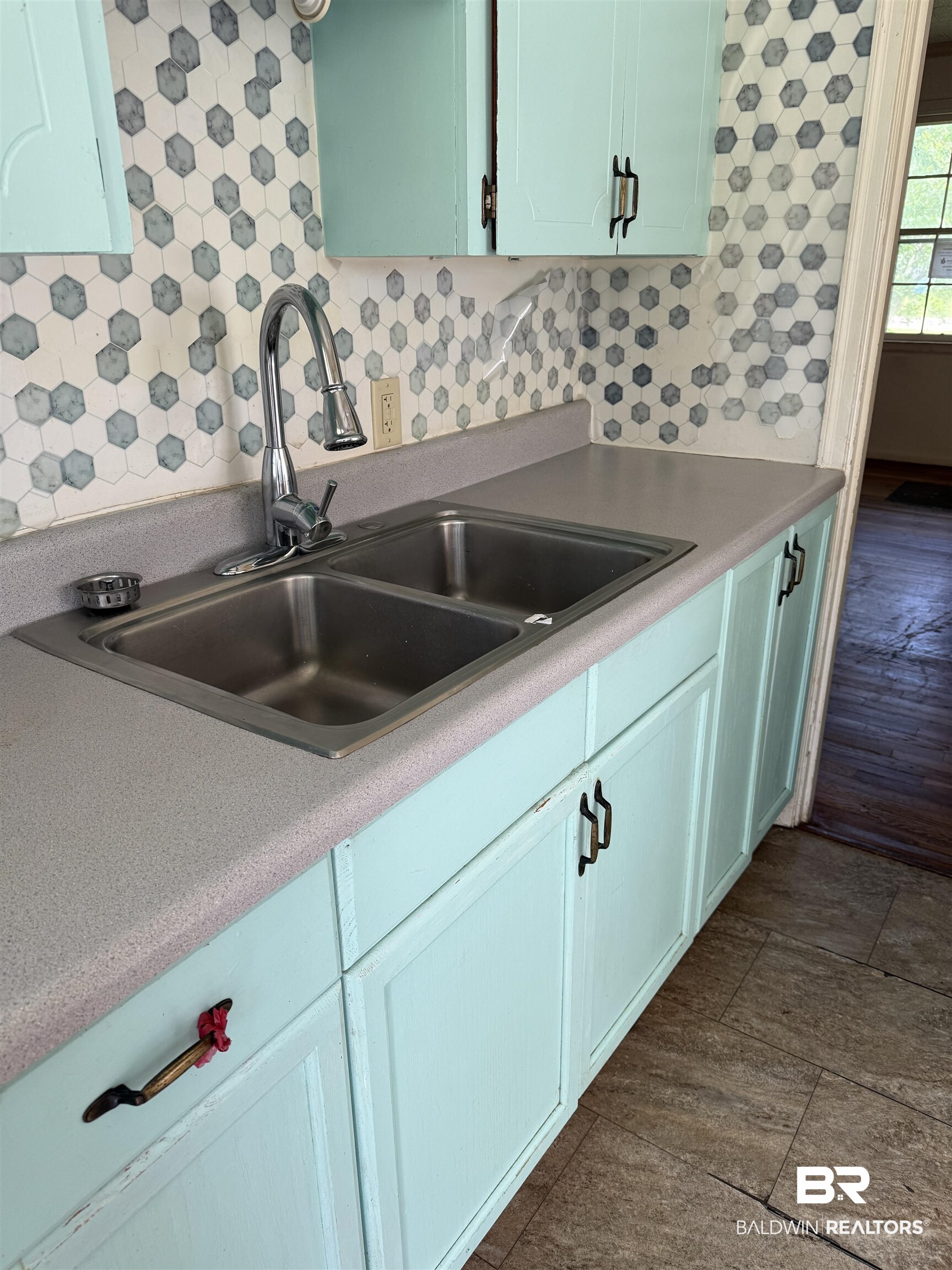 502 East Myrtle Avenue Foley, AL 36535 - Photo 4 of 9 Kitchen featuring tasteful backsplash and light countertops