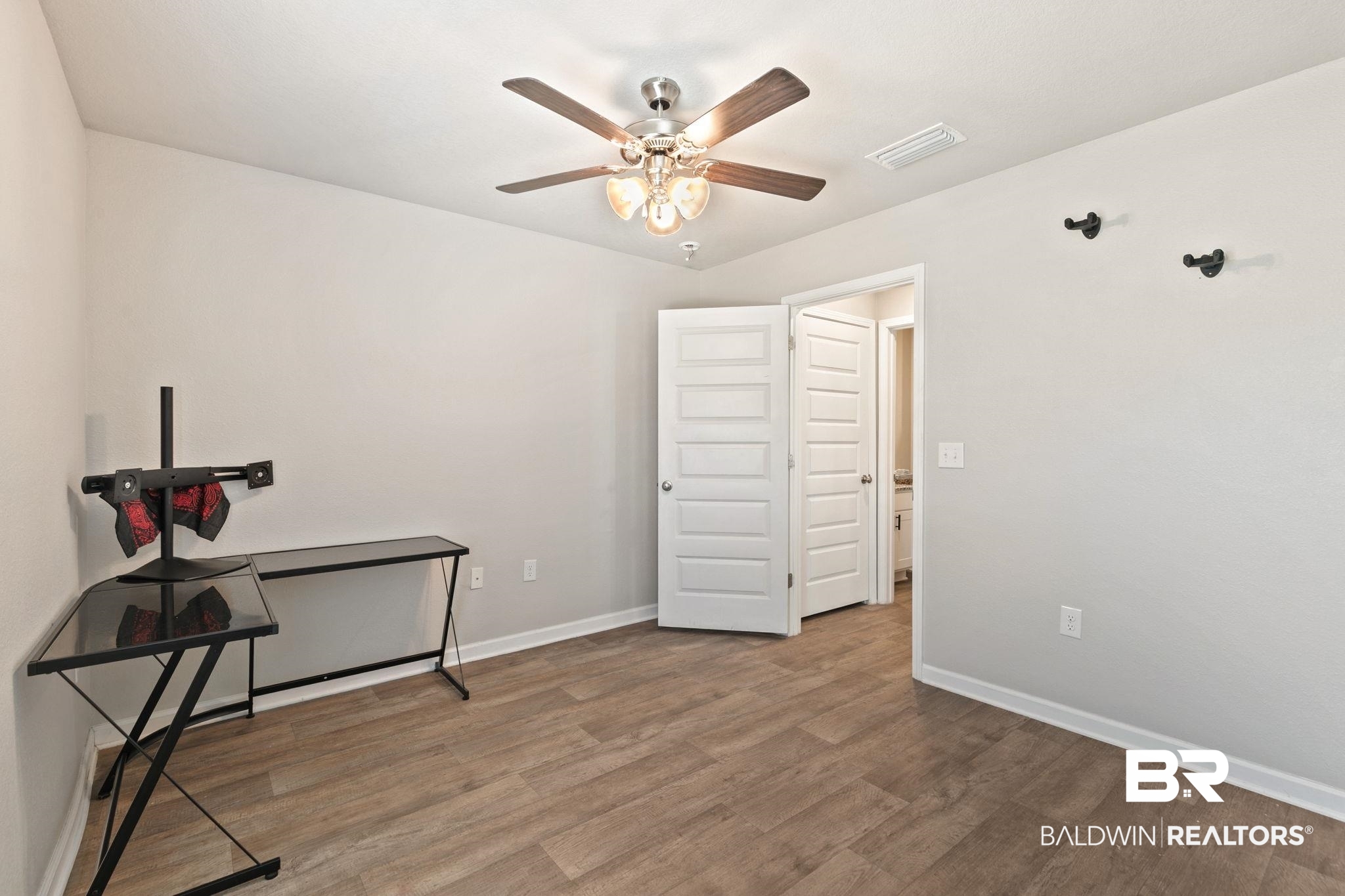 32234 Calder Court Daphne, AL 36527 - Photo 15 of 32 Unfurnished office with a ceiling fan and wood finished floors