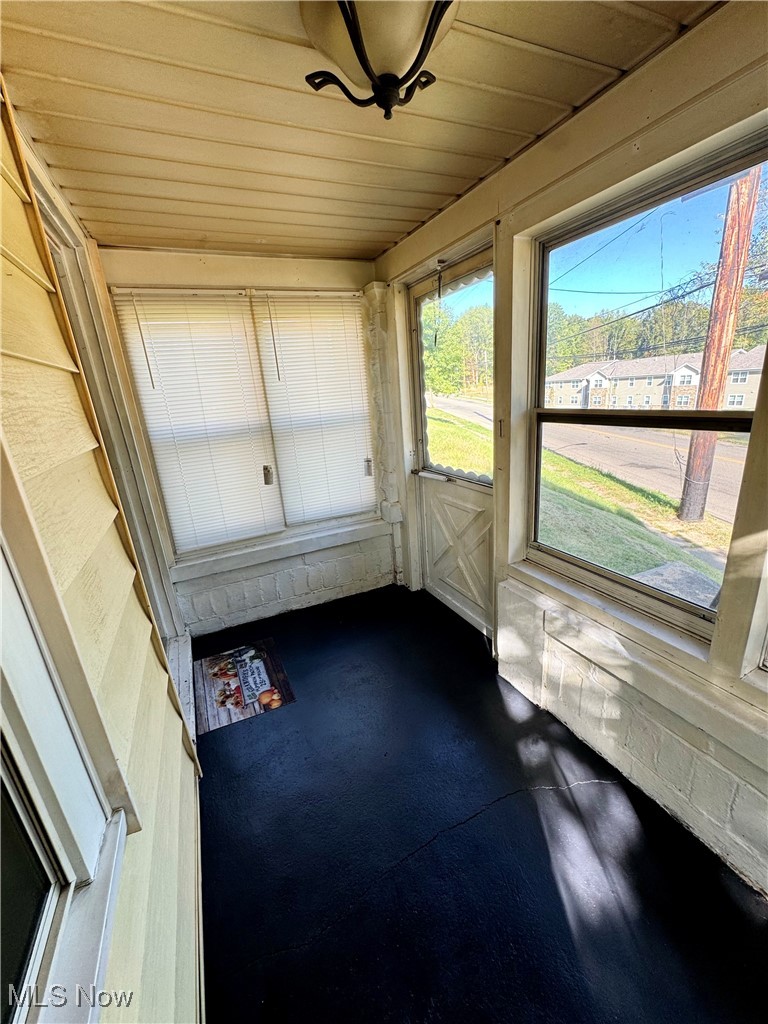 1325 Walnut Road Southeast Massillon, OH 44646 - Photo 28 of 34 Unfurnished sunroom with wood ceiling