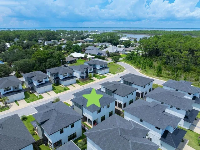 a kitchen with granite countertop a table chairs stove and cabinets