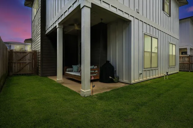 a view of a city with lots of residential buildings ocean and mountain view in back