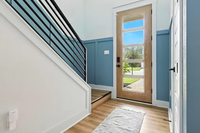 a kitchen with kitchen island granite countertop a sink appliances cabinets and a counter top space