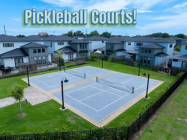 a bedroom with a bed and a flat tv screen on the dresser