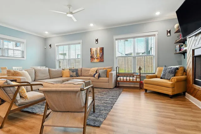 a bathroom with a double vanity sink a large mirror and a bathtub