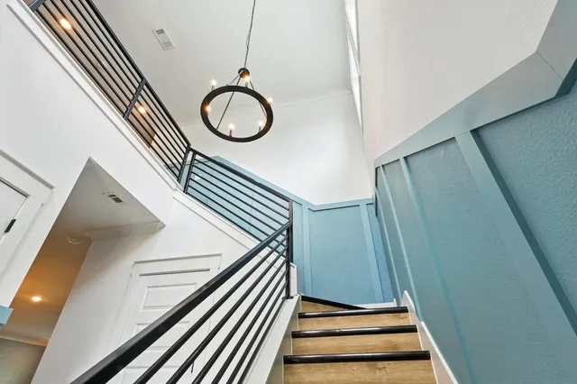 a bedroom with a bed and a television