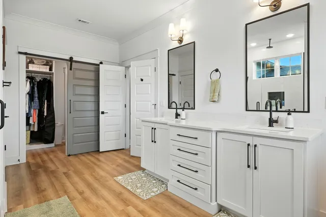 a view of a big building with a big yard and plants