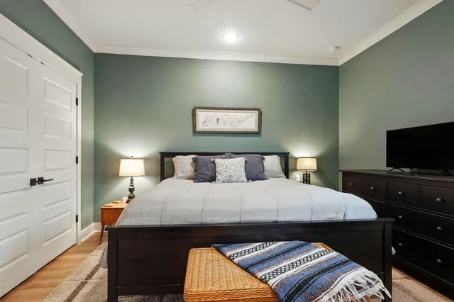 a view of a balcony with wooden floor and lake view