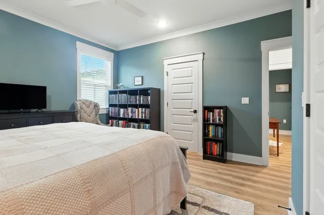 a view of staircase with wooden floor and chair