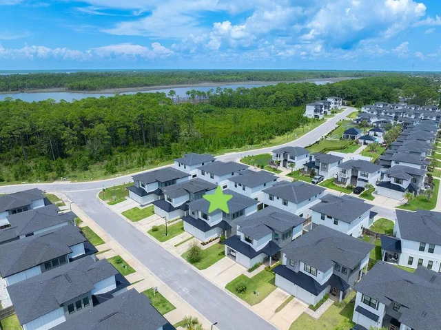 an aerial view of a house with a swimming pool