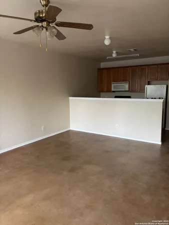a view of a air conditioner and an empty room