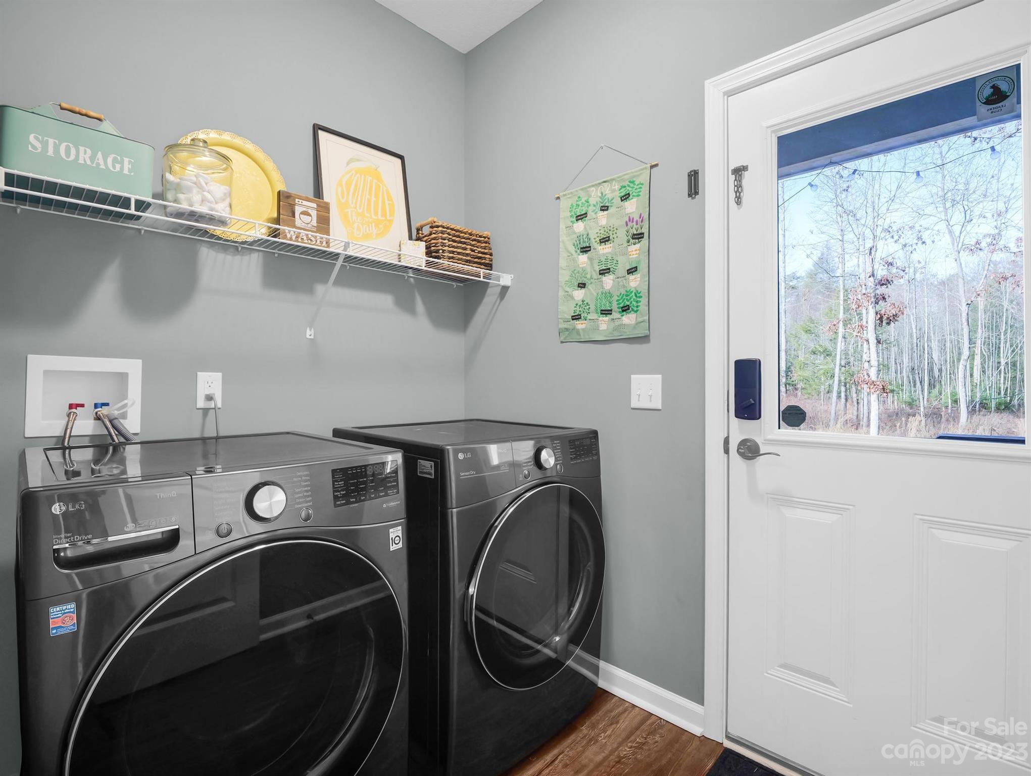 335 Mine Gap Road Flat Rock, NC 28731 - Photo 14 of 40 a utility room with cabinets dryer and washer