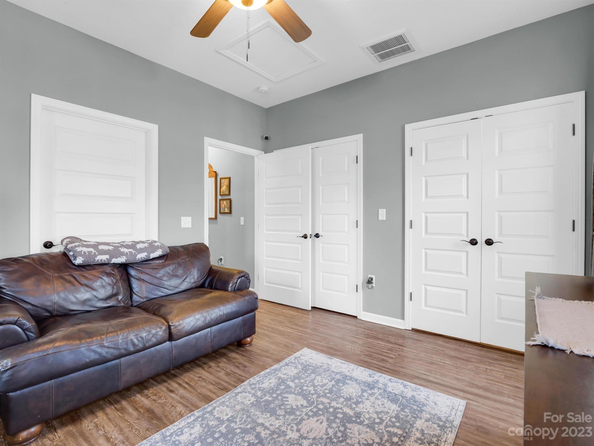 335 Mine Gap Road Flat Rock, NC 28731 - Photo 16 of 40 a living room with furniture and wooden floor