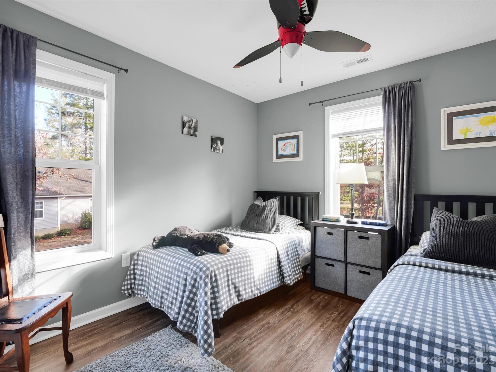 335 Mine Gap Road Flat Rock, NC 28731 - Photo 18 of 40 a bedroom with a bed and wooden floor