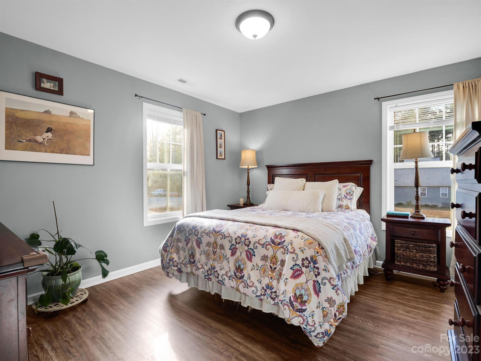 335 Mine Gap Road Flat Rock, NC 28731 - Photo 19 of 40 a bedroom with bed and wooden floor
