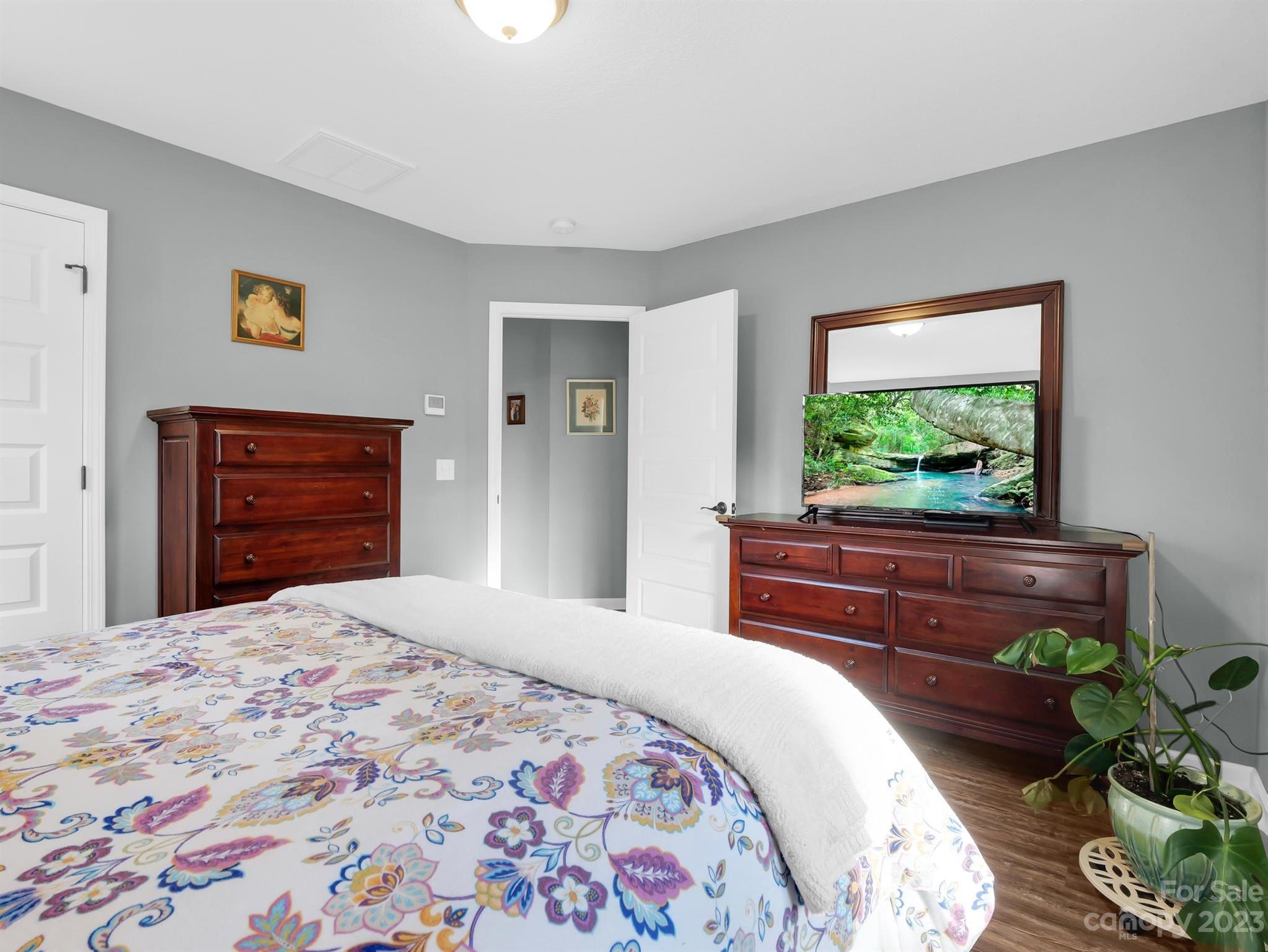 335 Mine Gap Road Flat Rock, NC 28731 - Photo 20 of 40 a bedroom with a bed and a dresser