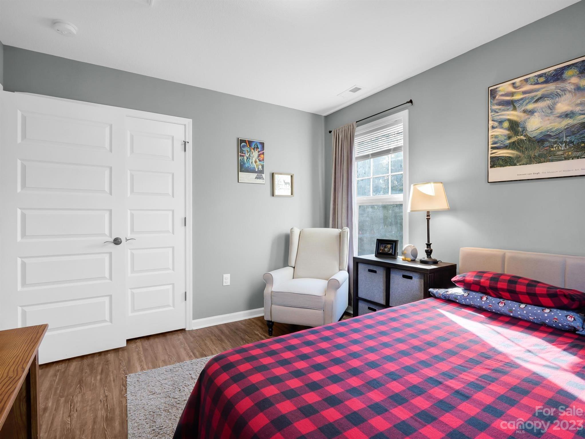 335 Mine Gap Road Flat Rock, NC 28731 - Photo 23 of 40 a bedroom with a bed and wooden floor