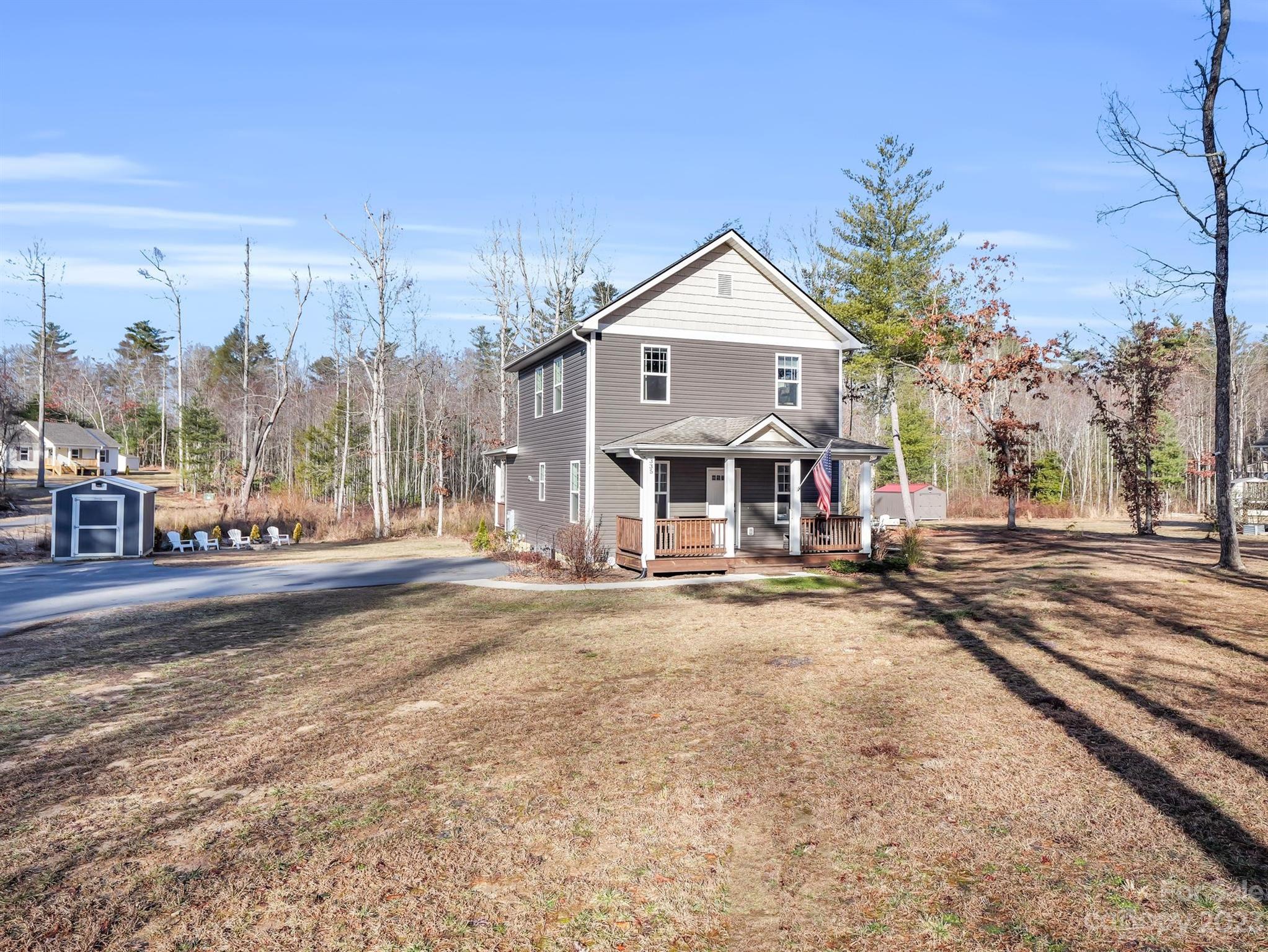 335 Mine Gap Road Flat Rock, NC 28731 - Photo 24 of 40 a view of a house with a yard