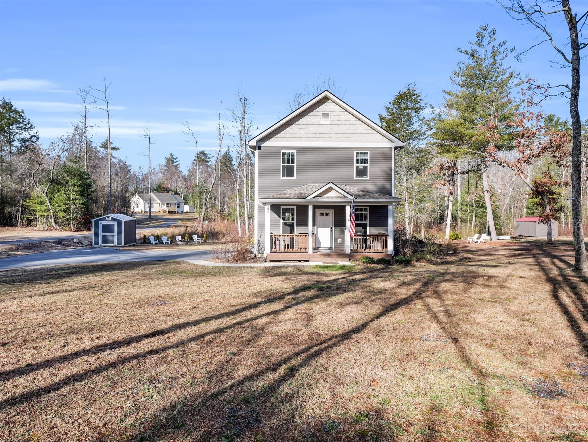 335 Mine Gap Road Flat Rock, NC 28731 - Photo 25 of 40 a front view of a house with a yard