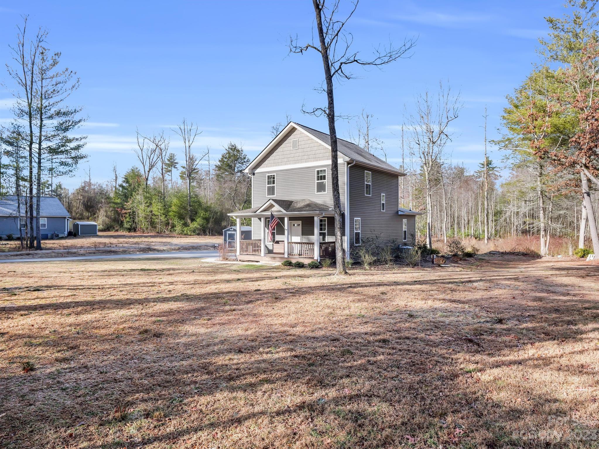 335 Mine Gap Road Flat Rock, NC 28731 - Photo 26 of 40 a view of a house with a yard