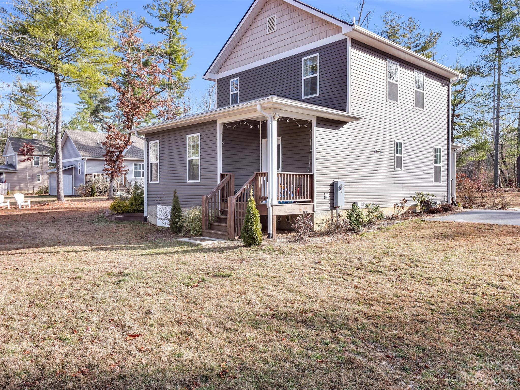 335 Mine Gap Road Flat Rock, NC 28731 - Photo 31 of 40 a view of a house with a yard