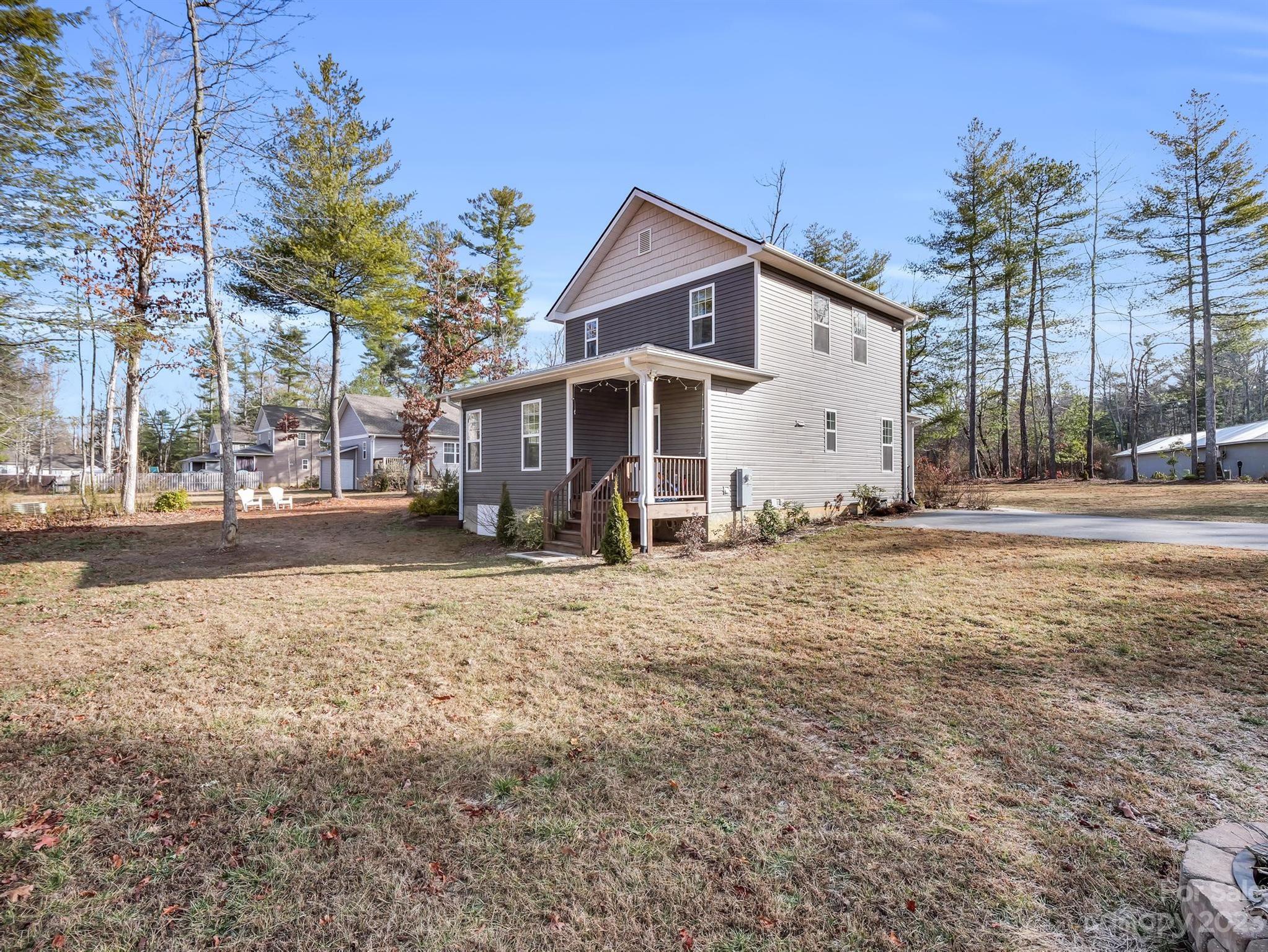 335 Mine Gap Road Flat Rock, NC 28731 - Photo 32 of 40 a view of a house with a yard and snow