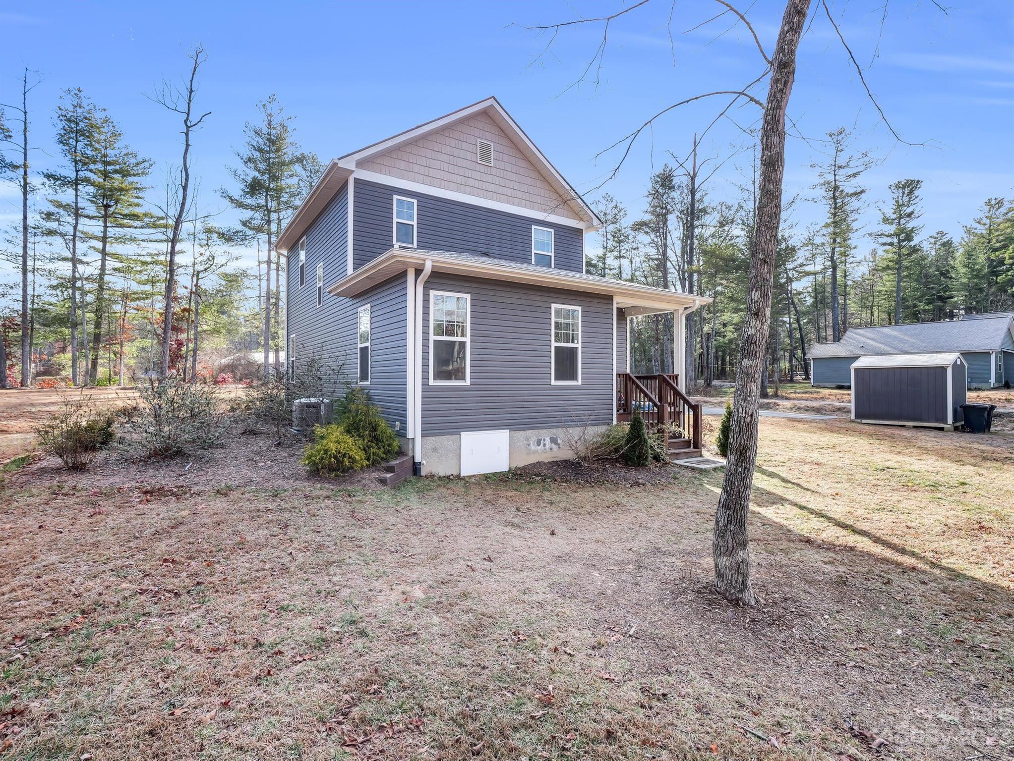 335 Mine Gap Road Flat Rock, NC 28731 - Photo 33 of 40 a view of a house with a yard