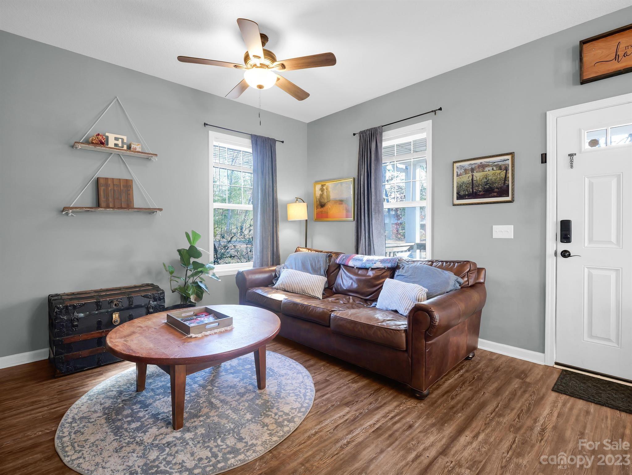 335 Mine Gap Road Flat Rock, NC 28731 - Photo 4 of 40 a living room with furniture and a potted plant